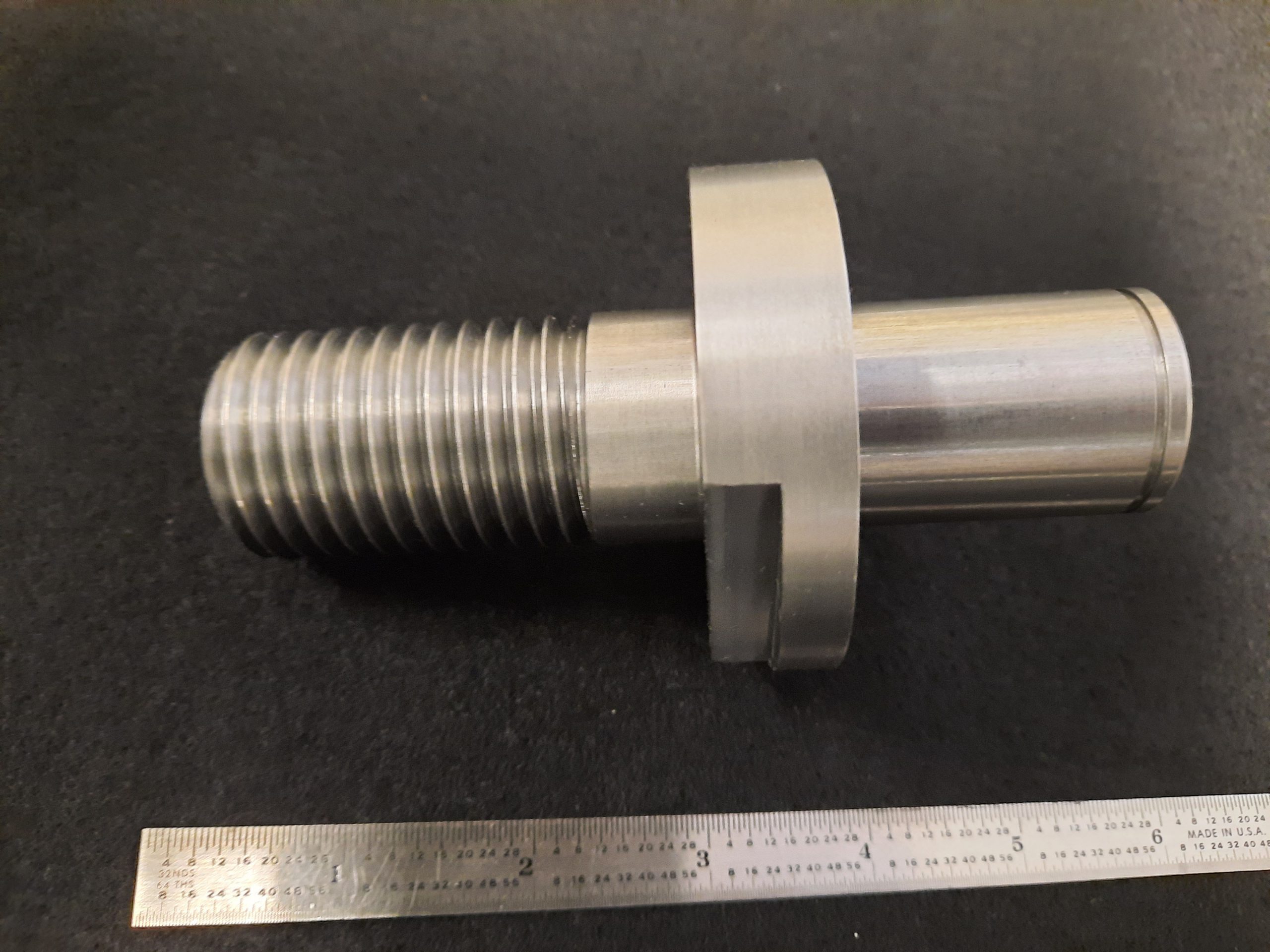 This part been turned and threaded on CNC Lathe Machine. The flat on the part was milled on the cnc milling machine.